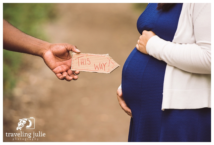 Sign pointing to pregnant belly