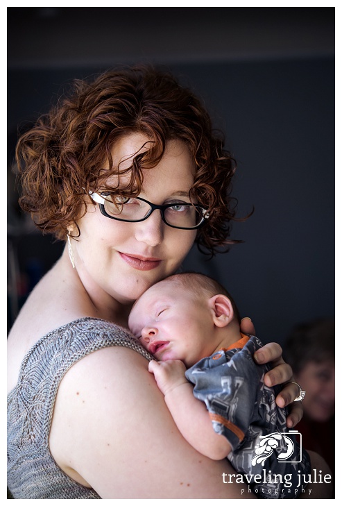 Smiling mom with newborn portrait