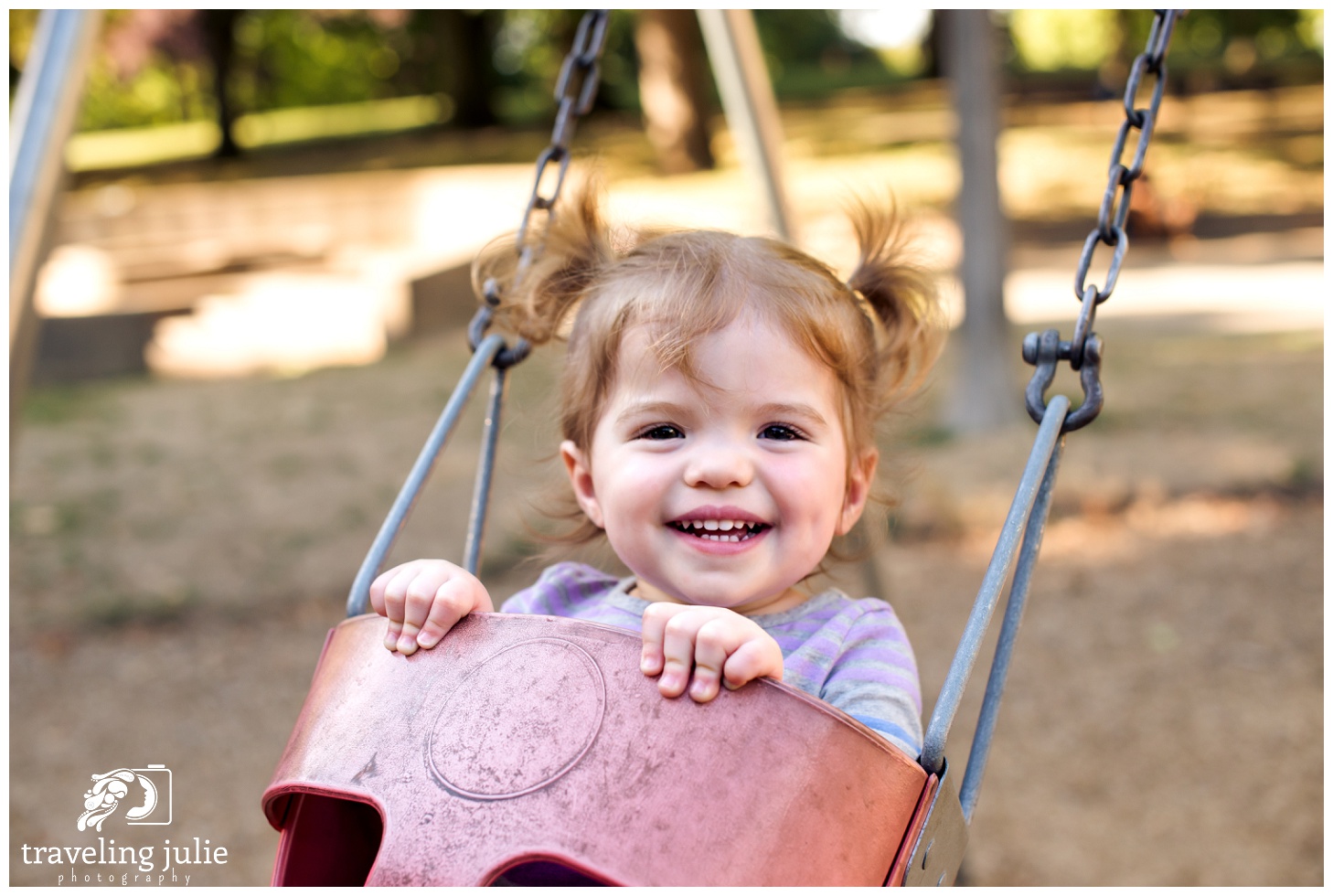 Smiling toddler on swing