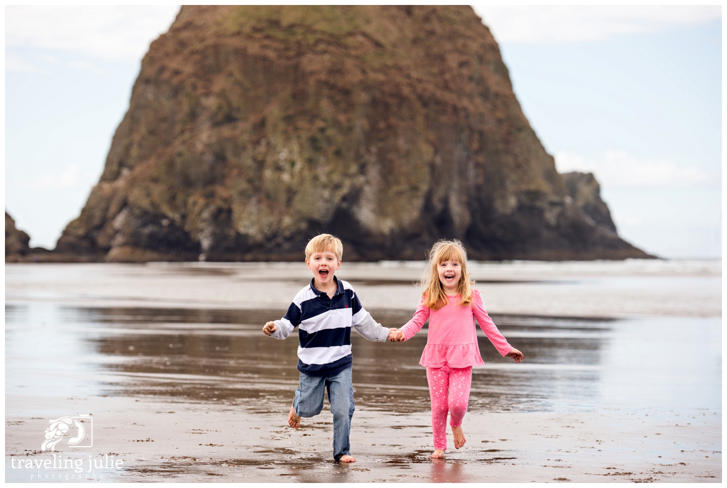 twins playing by Haystack Rock