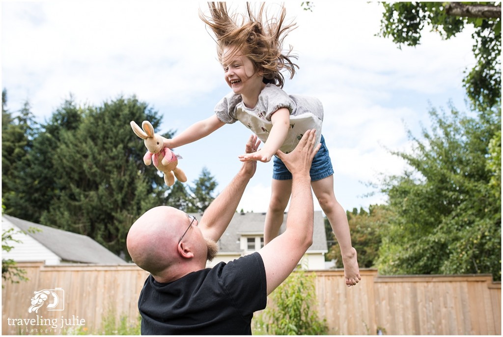 dad tossing daughter in the air